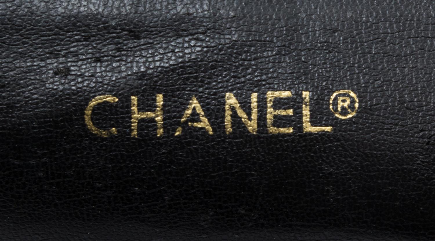 A Chanel Black Distressed Leather Quilted Handbag, 12" x 8" x 4".