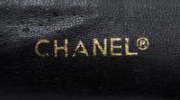 A Chanel Black Distressed Leather Quilted Handbag, 12" x 8" x 4".