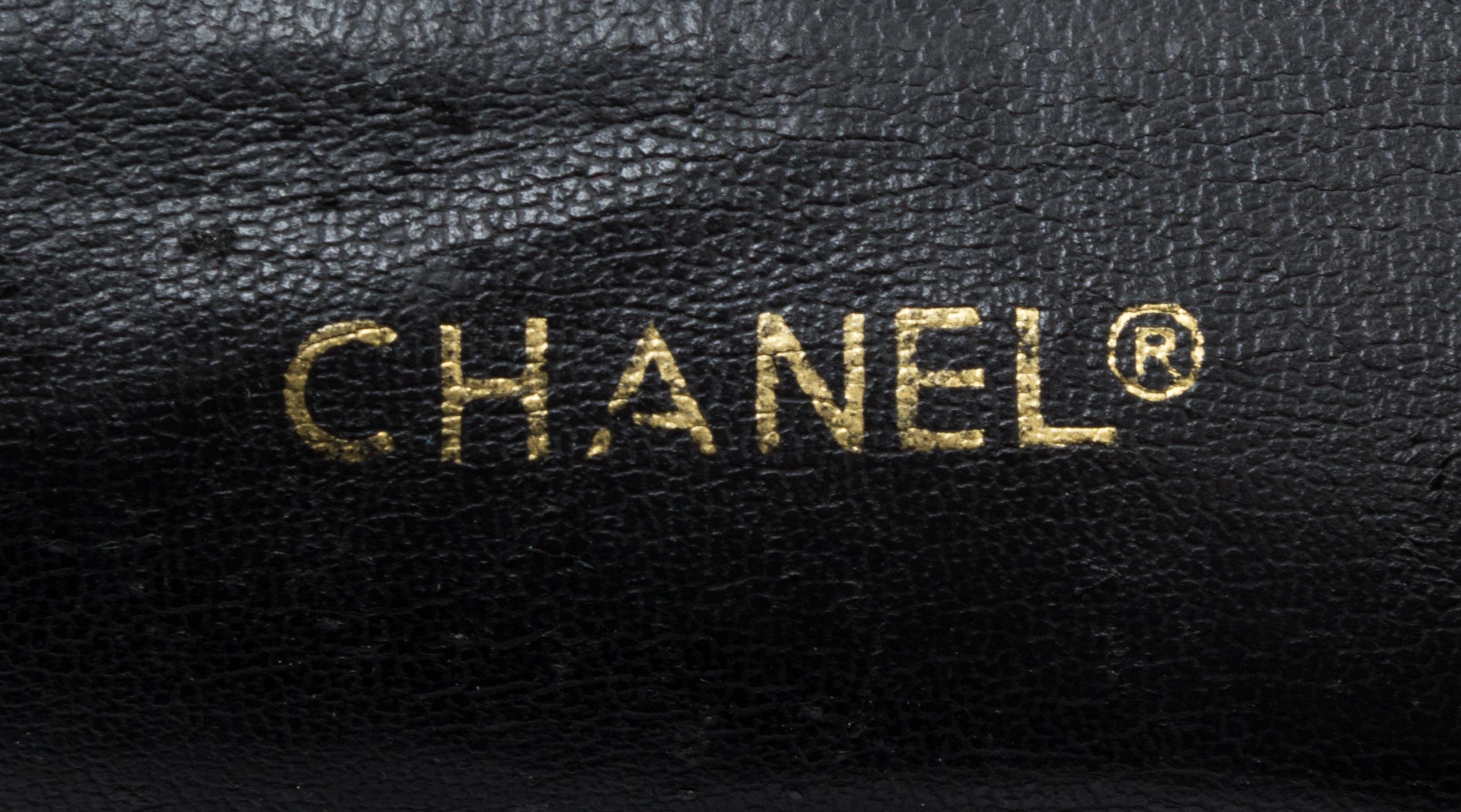 A Chanel Black Distressed Leather Quilted Handbag, 12" x 8" x 4".