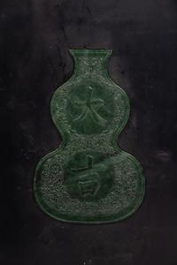 A Chinese Spinach Jade Inset Carved Hardwood Panel