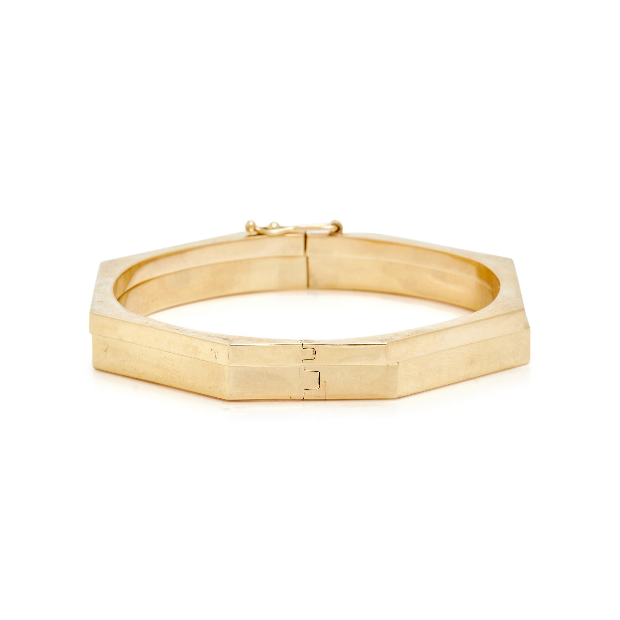THREE YELLOW GOLD BANGLE BRACELETS