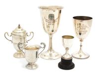 A Collection of Five Silver Trophy Cups, English and American, Various Makers, one mounted on plastic stand