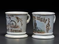 Two Cyclist's Porcelain Shaving Mugs