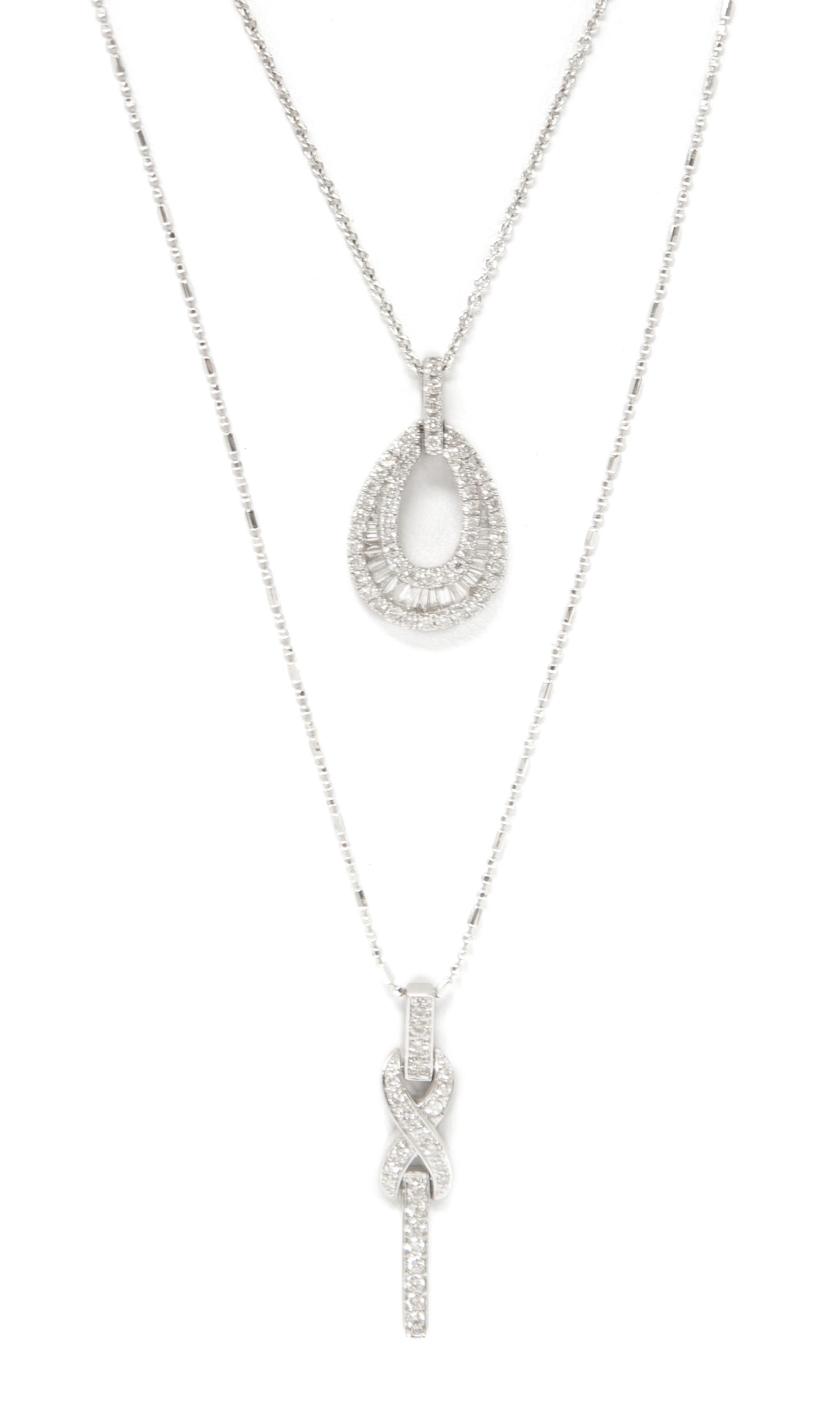 A Collection of 18 Karat White Gold and Diamond Pendant Necklaces, 5.10 dwts.