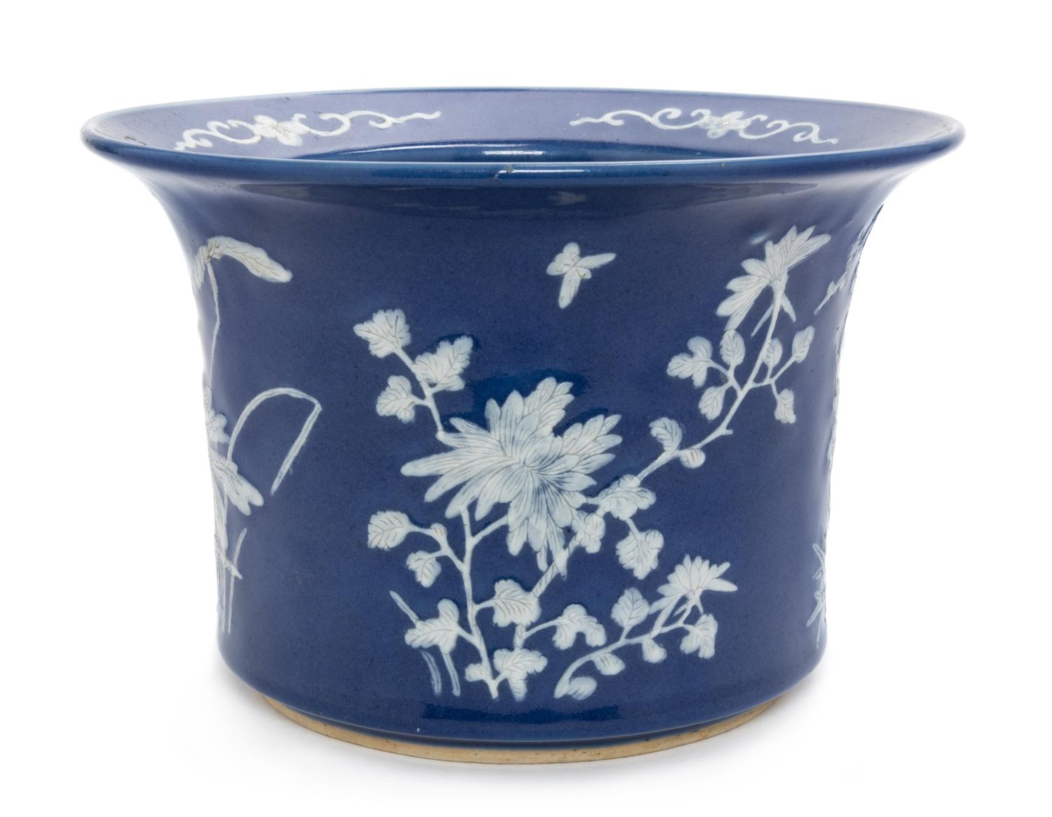 A Chinese White Slip Decorated Blue Glazed Porcelain Cache Pot Diameter 10 1/2 inches.