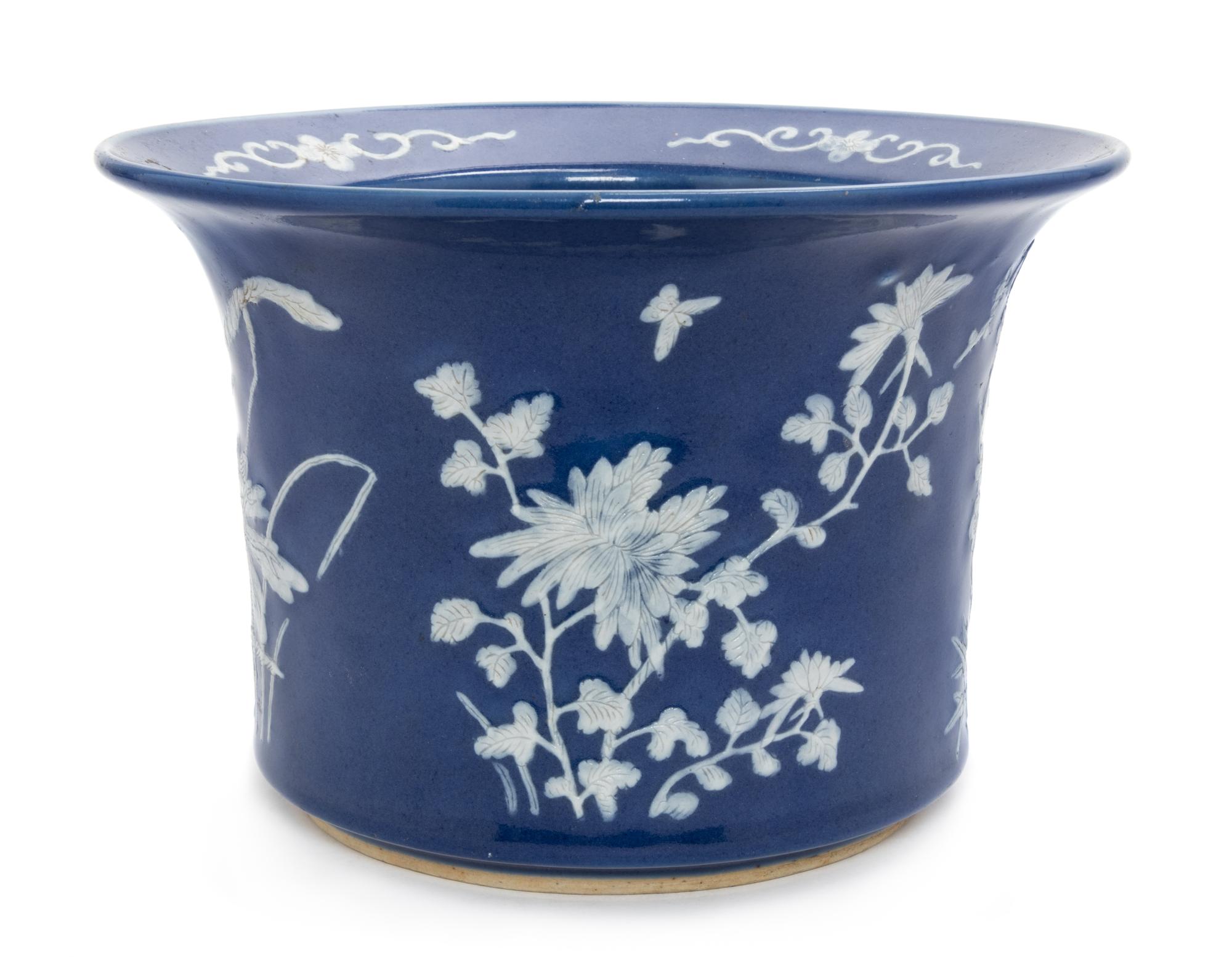 A Chinese White Slip Decorated Blue Glazed Porcelain Cache Pot Diameter 10 1/2 inches.