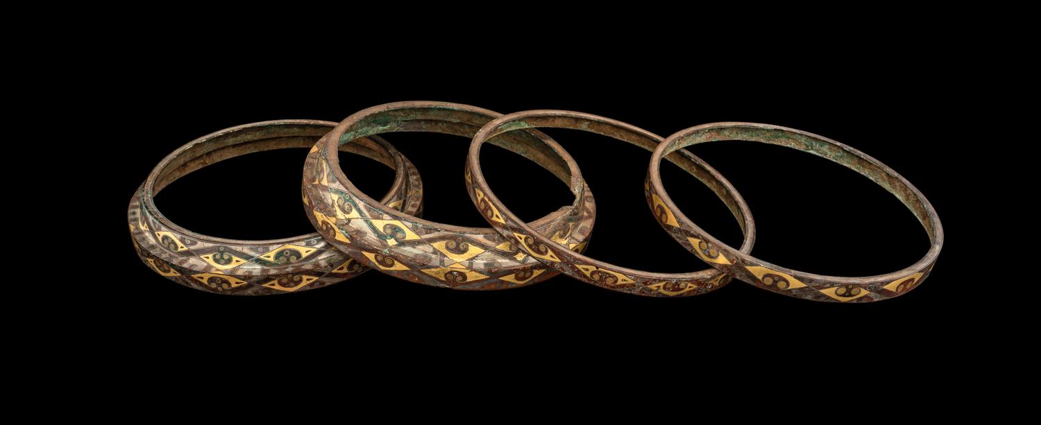 A Group of Four Chinese Gold and Silver Inlaid Bronze Fittings from Hu Vessels