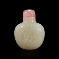 A Chinese carved white jade snuff bottle