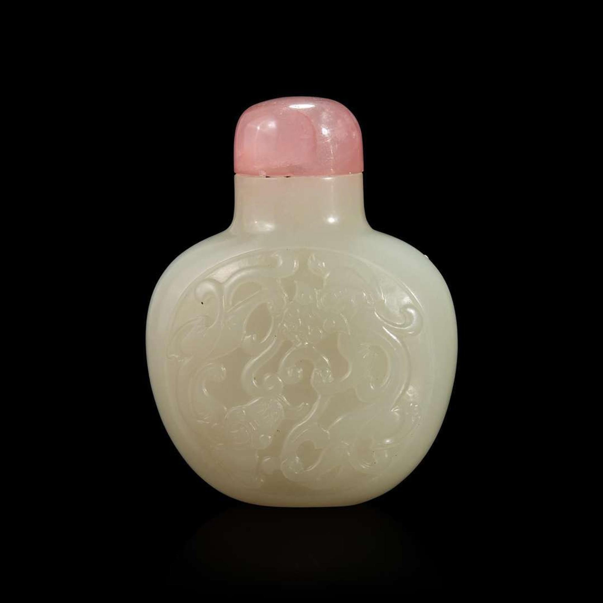 A Chinese carved white jade snuff bottle