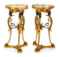 A Pair of Directoire Style Parcel-Gilt and Patinated Bronze Gueridons
