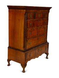 A Queen Anne Figured Mahogany Chest on Stand