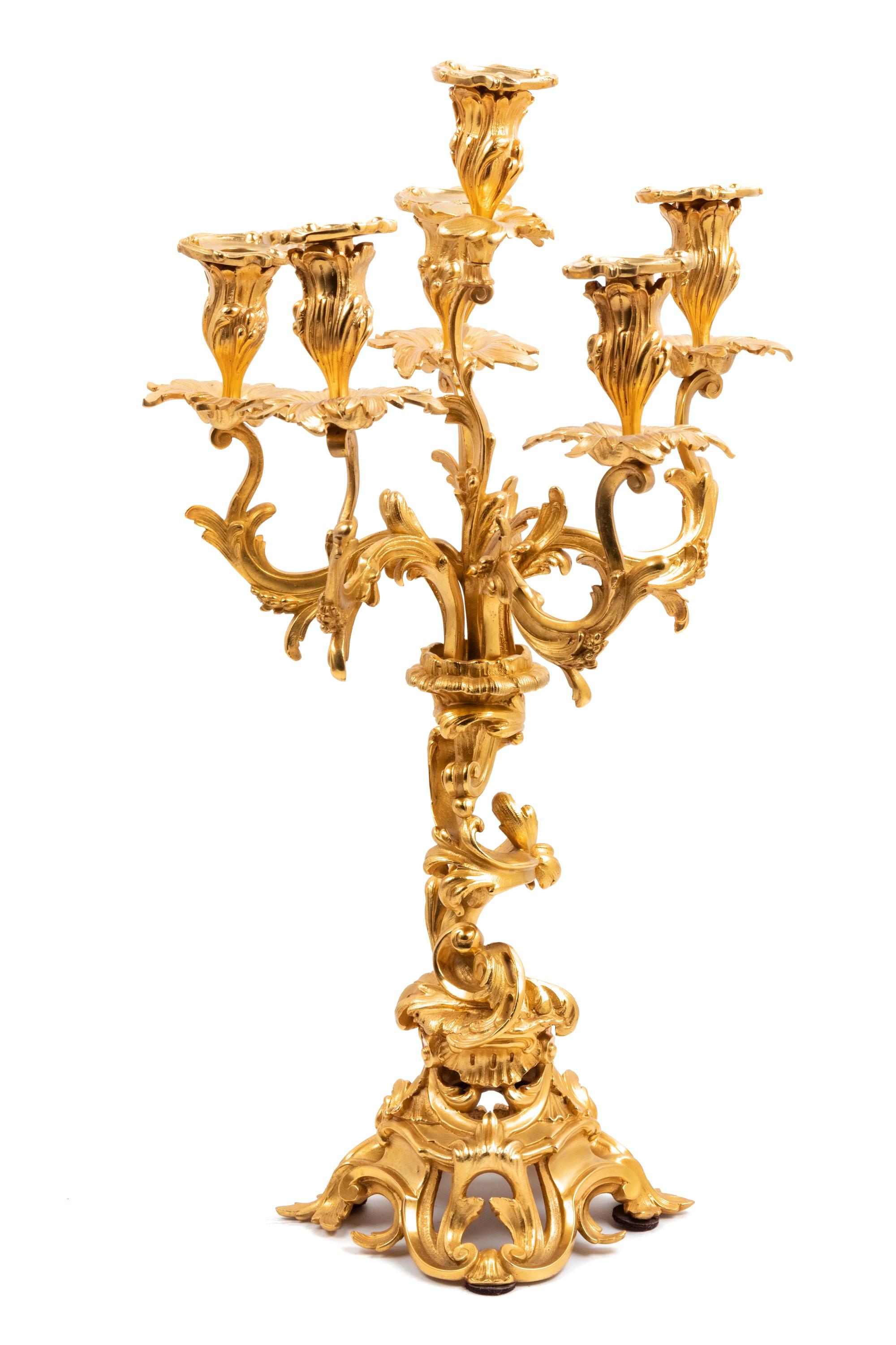 A Louis XV Style Gilt Bronze Three-Piece Clock Garniture