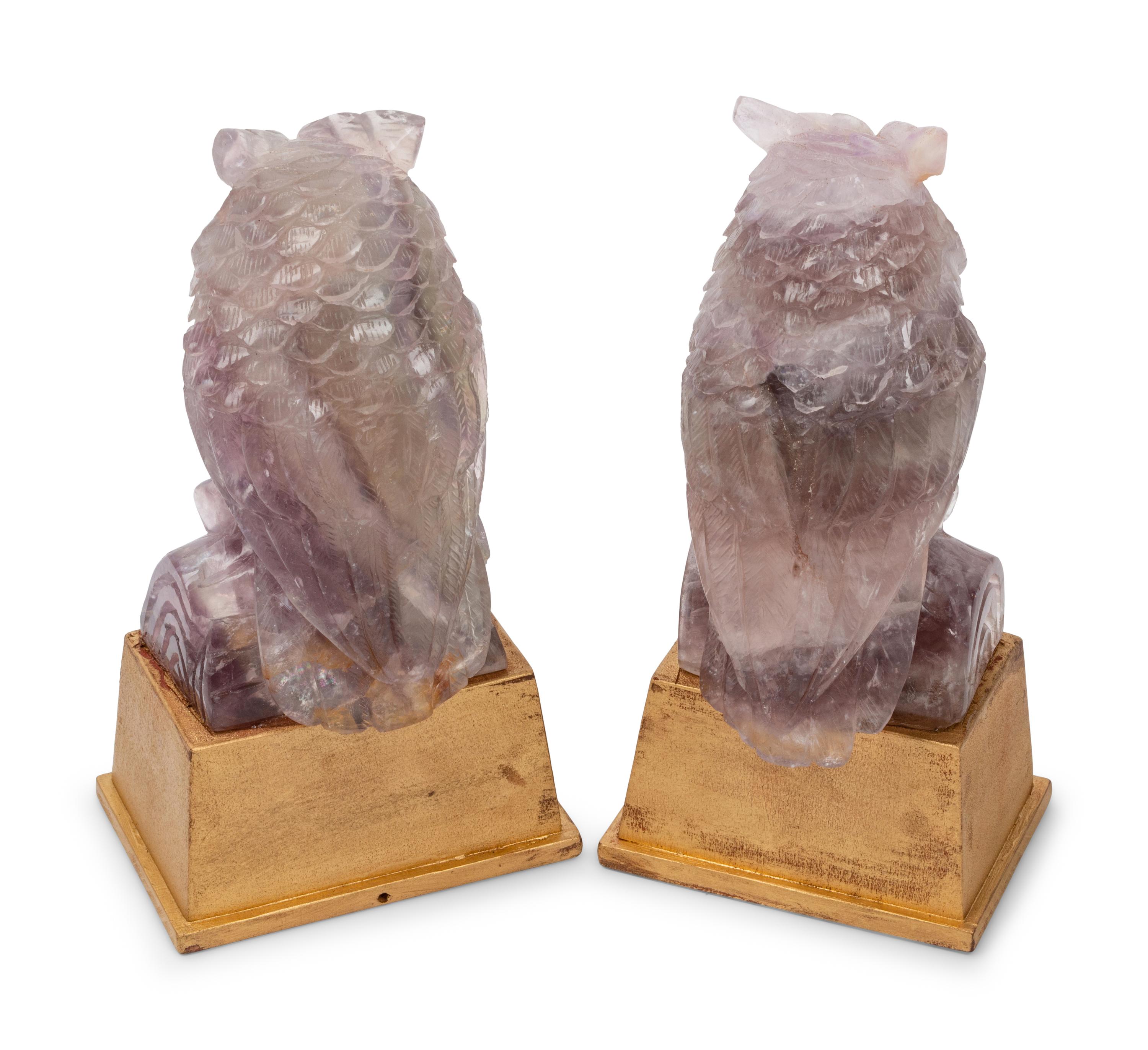 A Pair of Carved Amethyst Owls with Carved Wood Bases