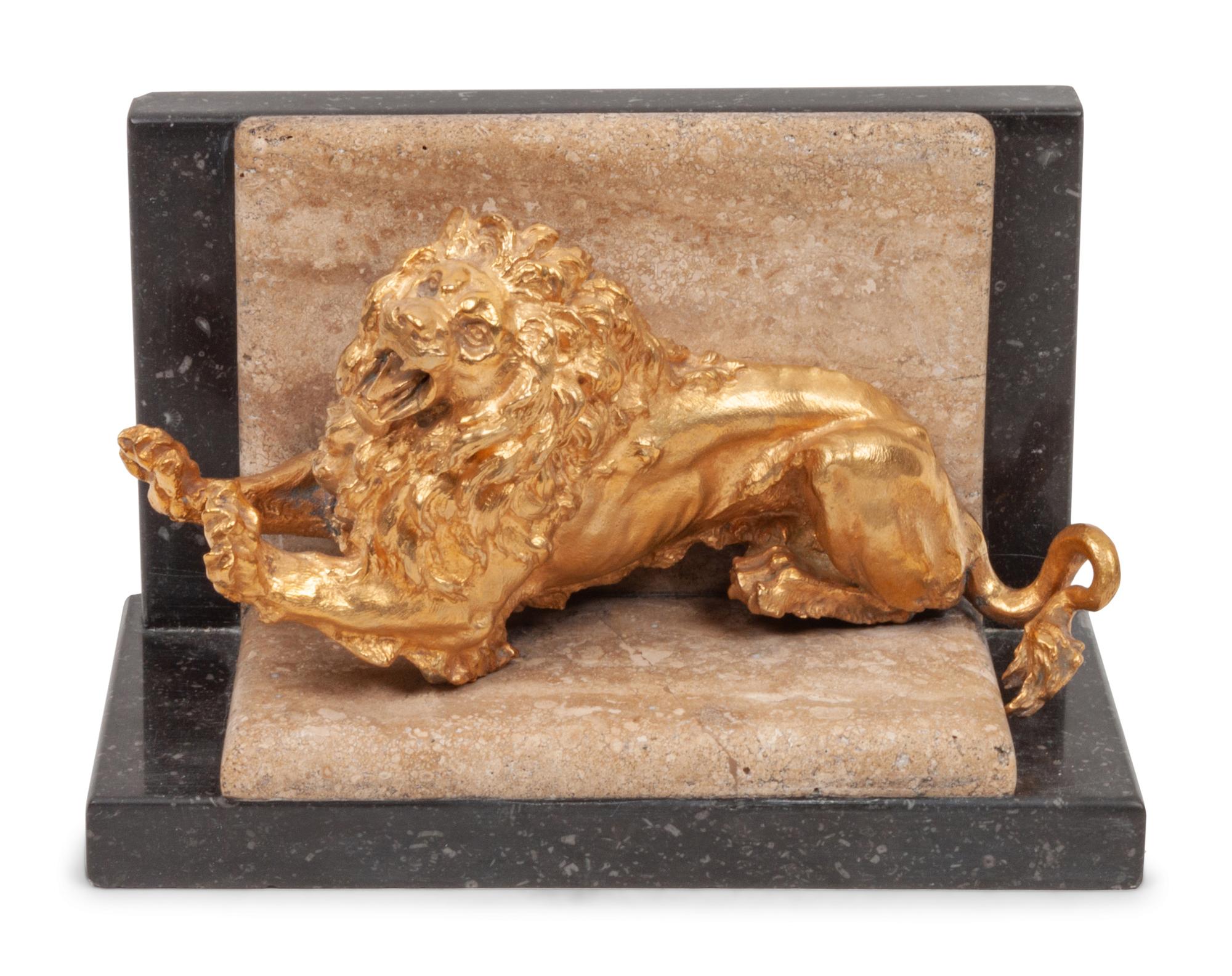 A Gilt Bronze and Limestone Lion Bookend