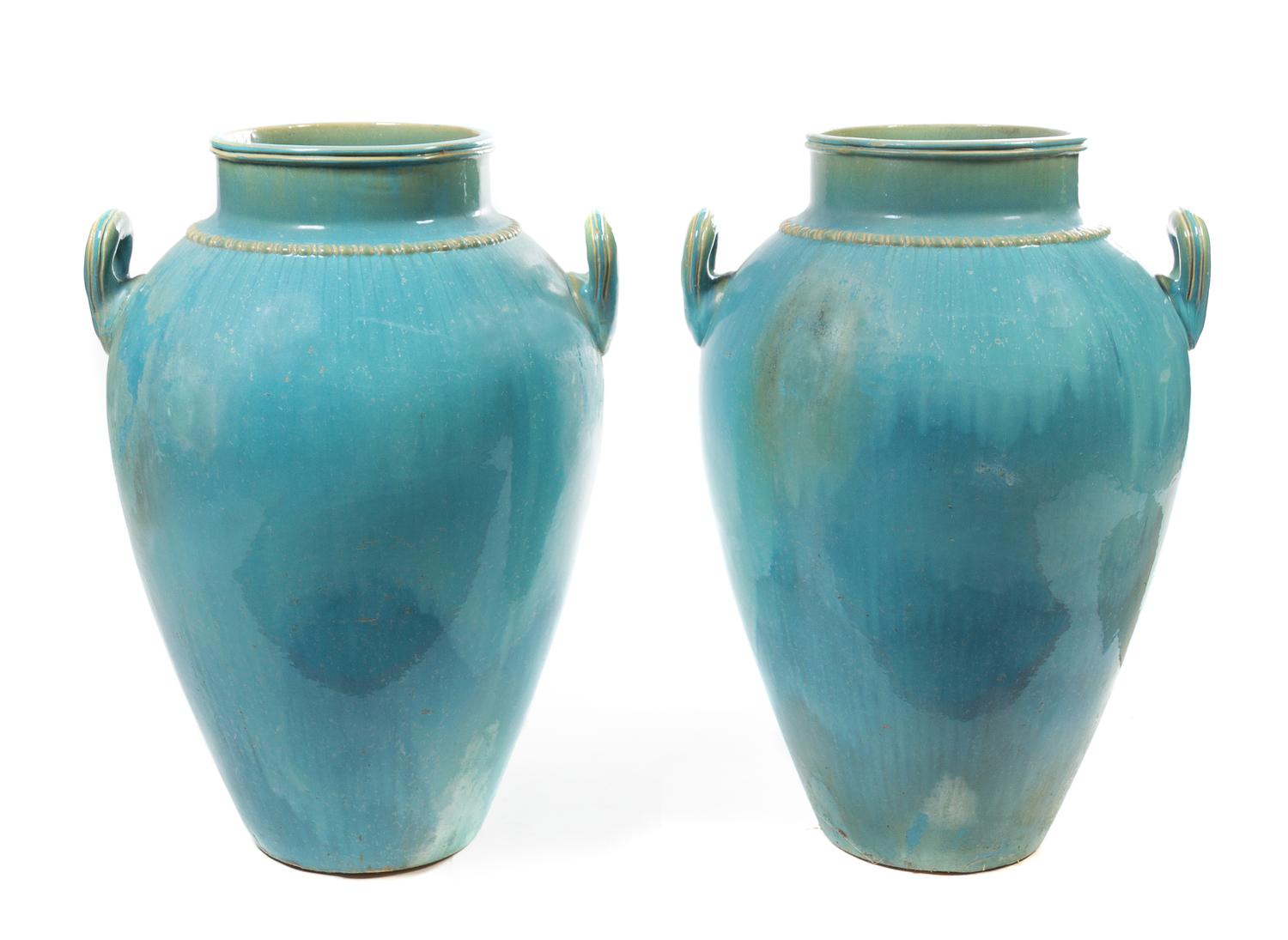 A Pair of Turquoise Glazed Ceramic Urns Height 34 inches. — 20TH CENTURY