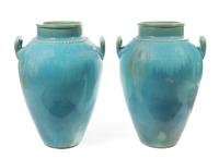 A Pair of Turquoise Glazed Ceramic Urns Height 34 inches. — 20TH CENTURY