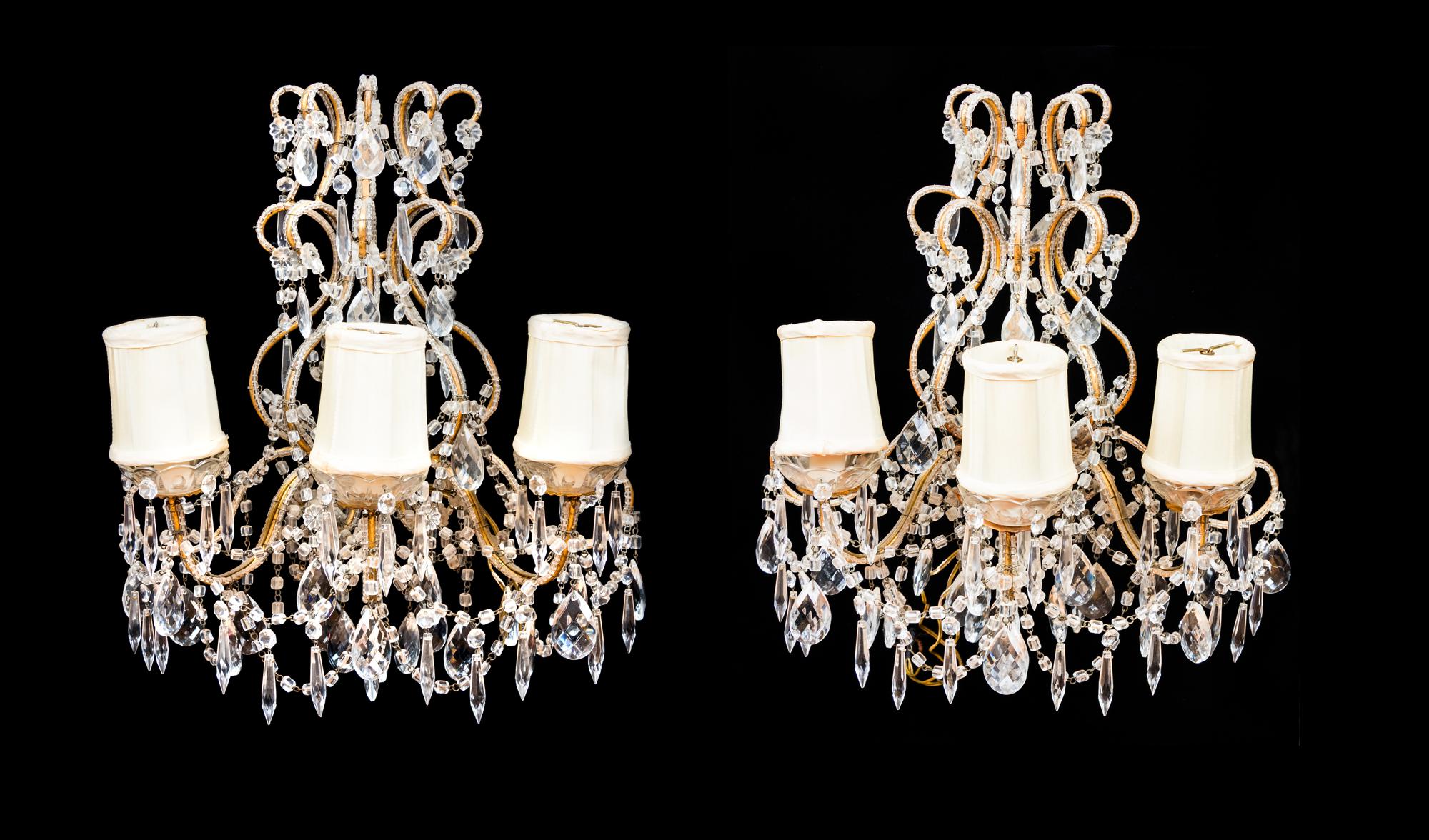 APPROVED FOR DONATION A Pair of Continental Giltwood and Cut Glass Three-Light Sconces