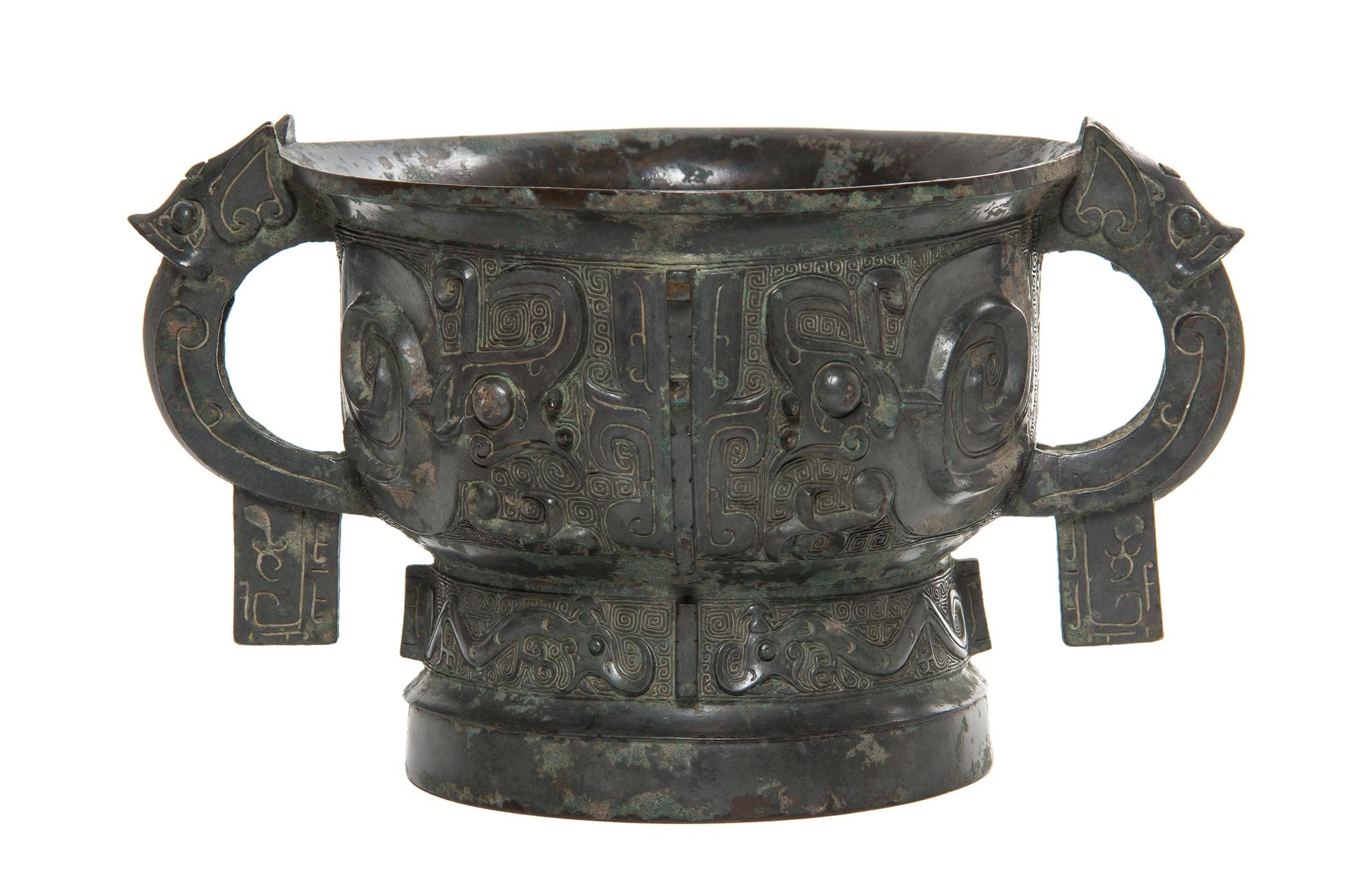 A Bronze Ritual Gui Vessel Width over handles 10 5/8 inches.