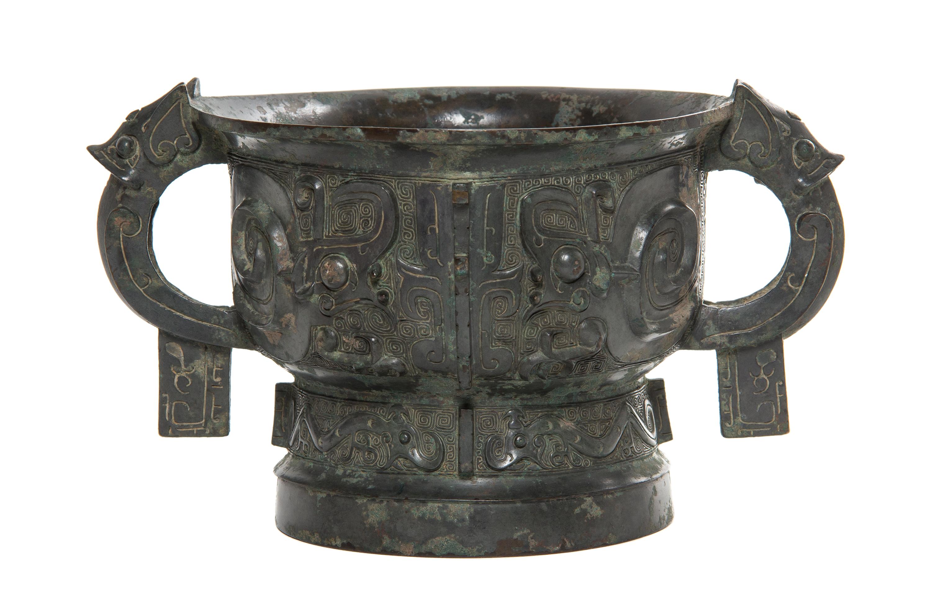 A Bronze Ritual Gui Vessel Width over handles 10 5/8 inches.