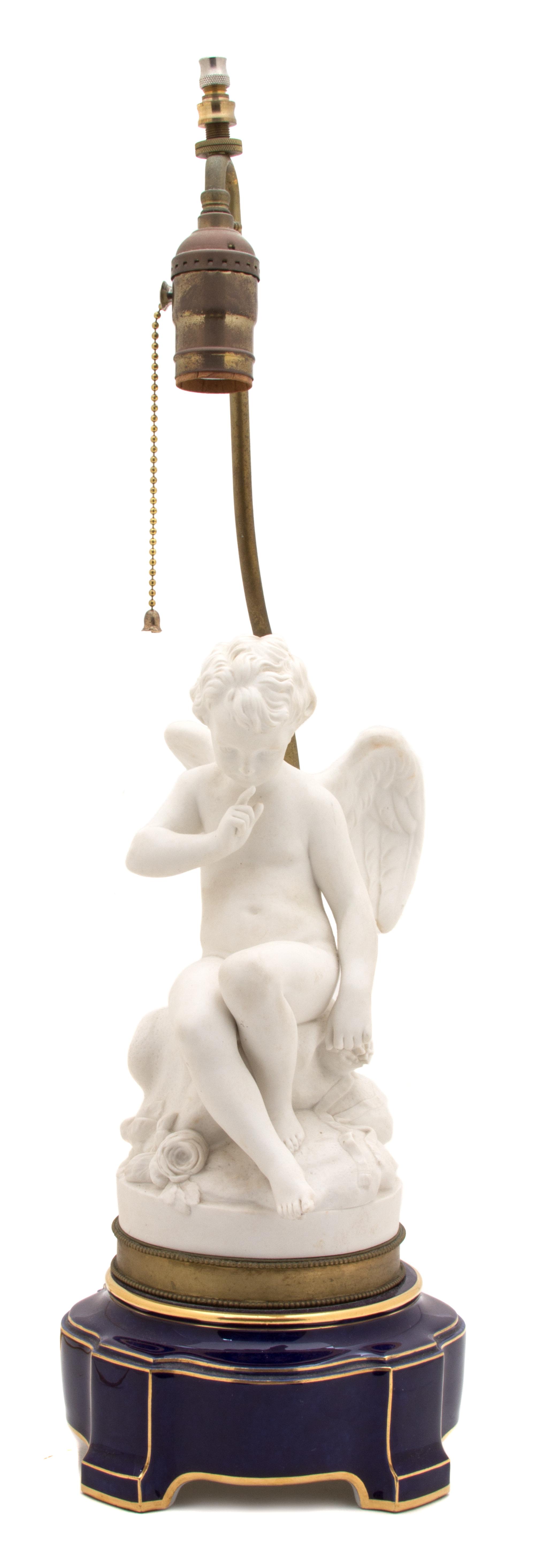 A French Bisque Porcelain Cupid Height of lamp 14 inches. — 19TH CENTURY