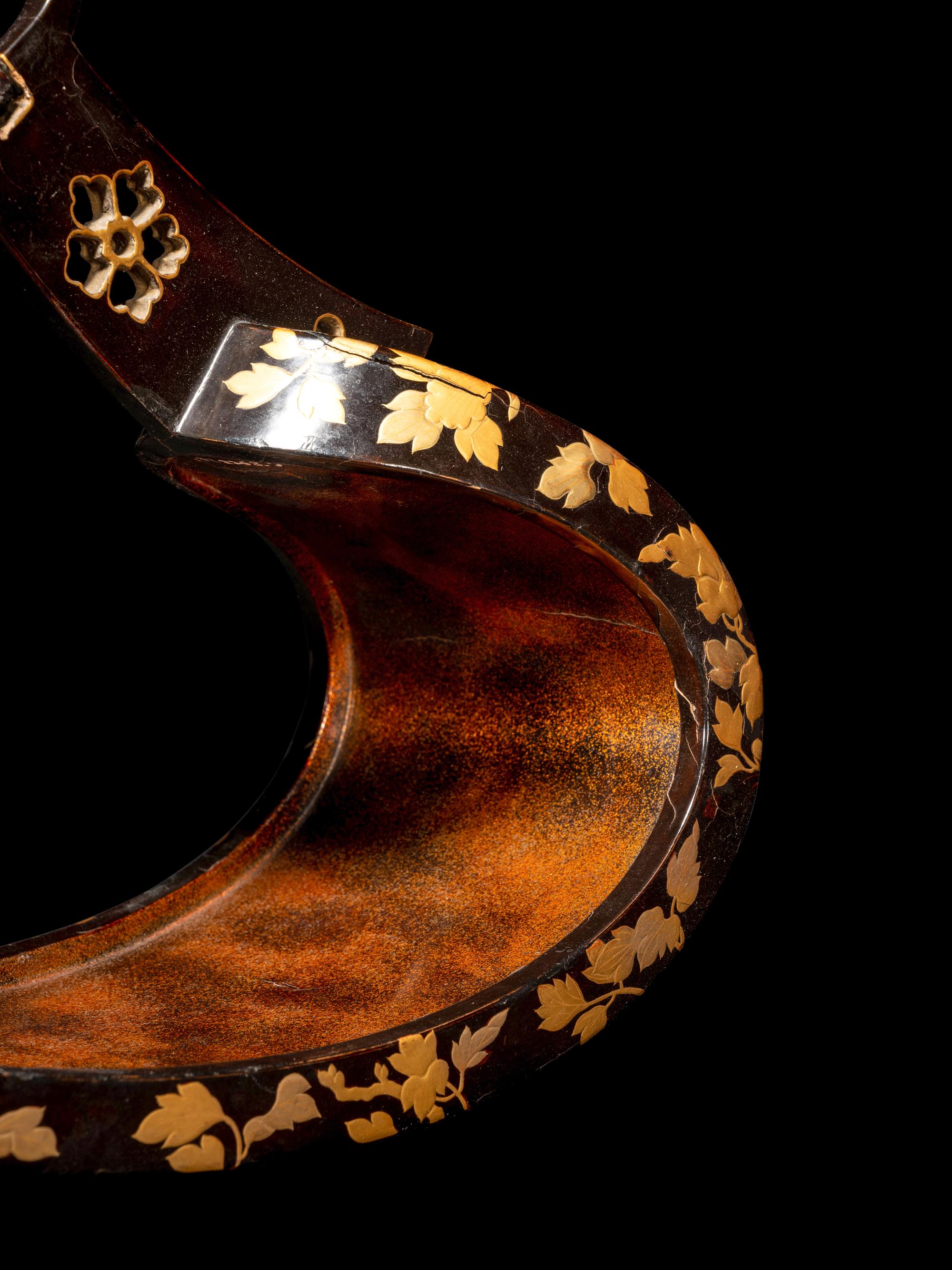A Pair of Japanese Gold and Black Lacquered Stirrups