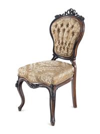 A Set of Four Rococo Revival Carved Balloon-Back Side Chairs