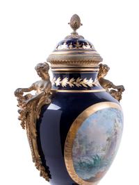 A Sèvres Style Gilt Bronze Mounted Painted and Parcel Gilt Porcelain Covered Urn