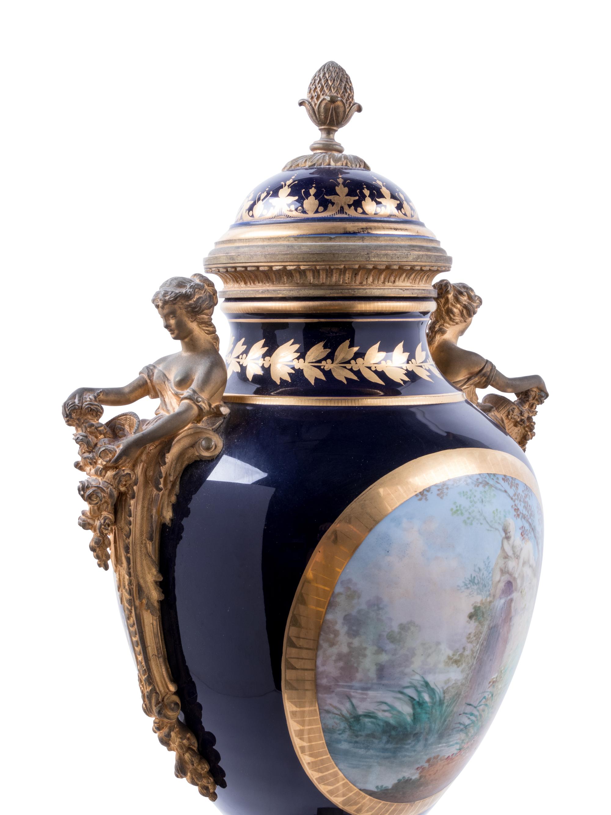 A Sèvres Style Gilt Bronze Mounted Painted and Parcel Gilt Porcelain Covered Urn