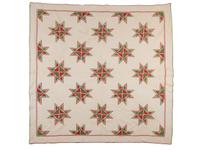 A Hand-Sewn Red and Green "Star" Pattern Quilt