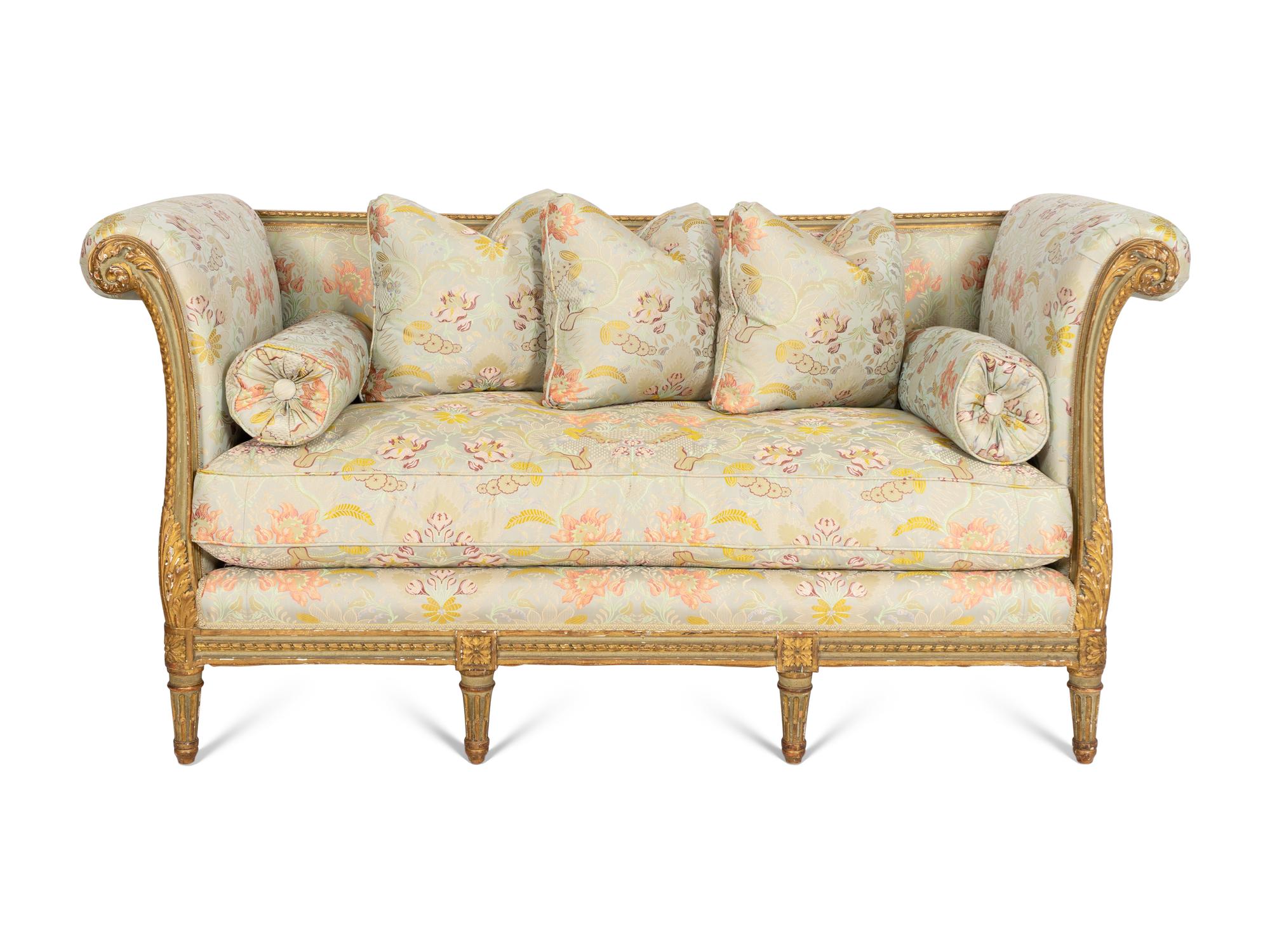 A Louis XVI Style Painted and Parcel Gilt Settee