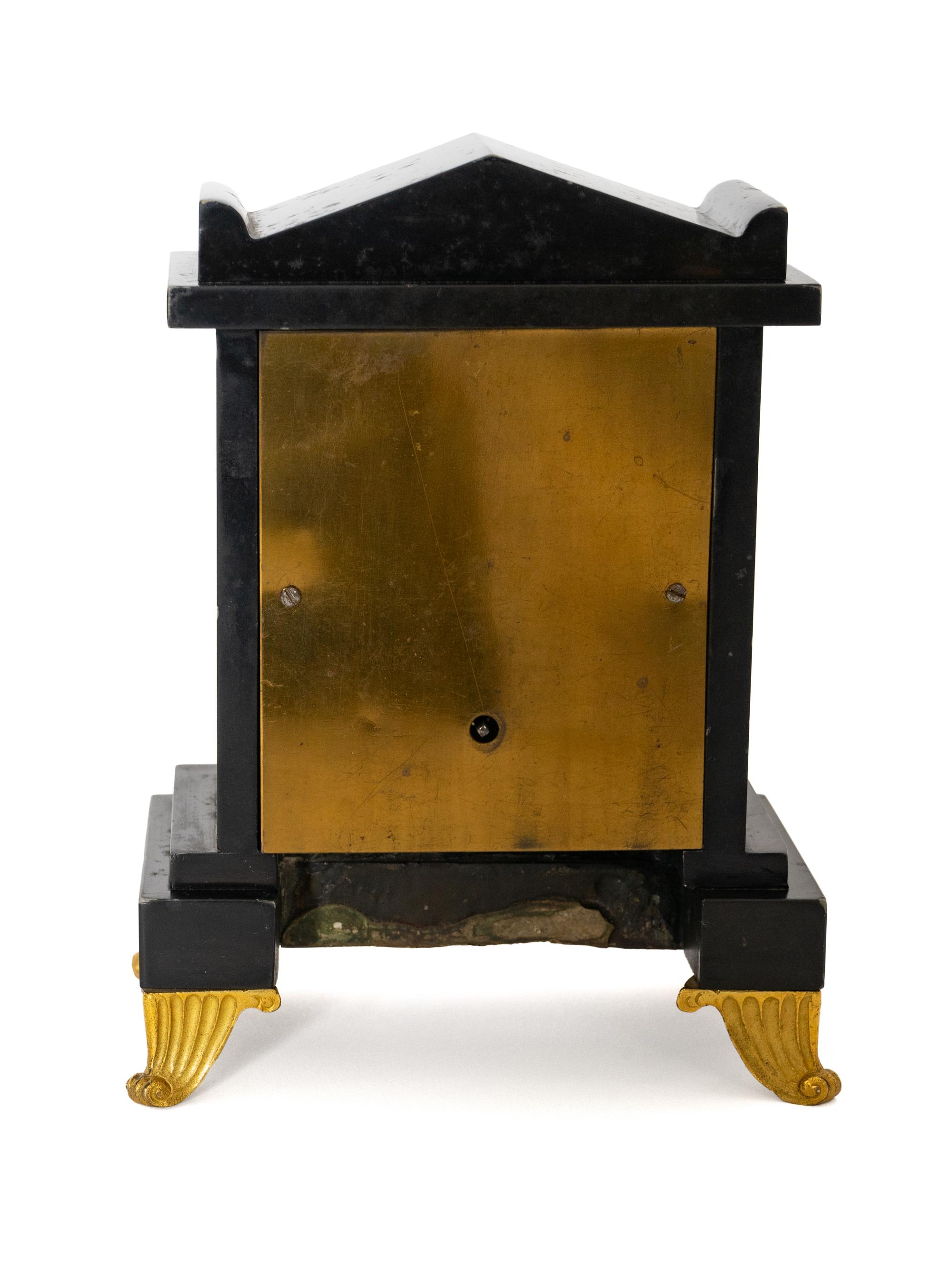 A Regency Black Slate and Gilt Bronze Mantel Clock