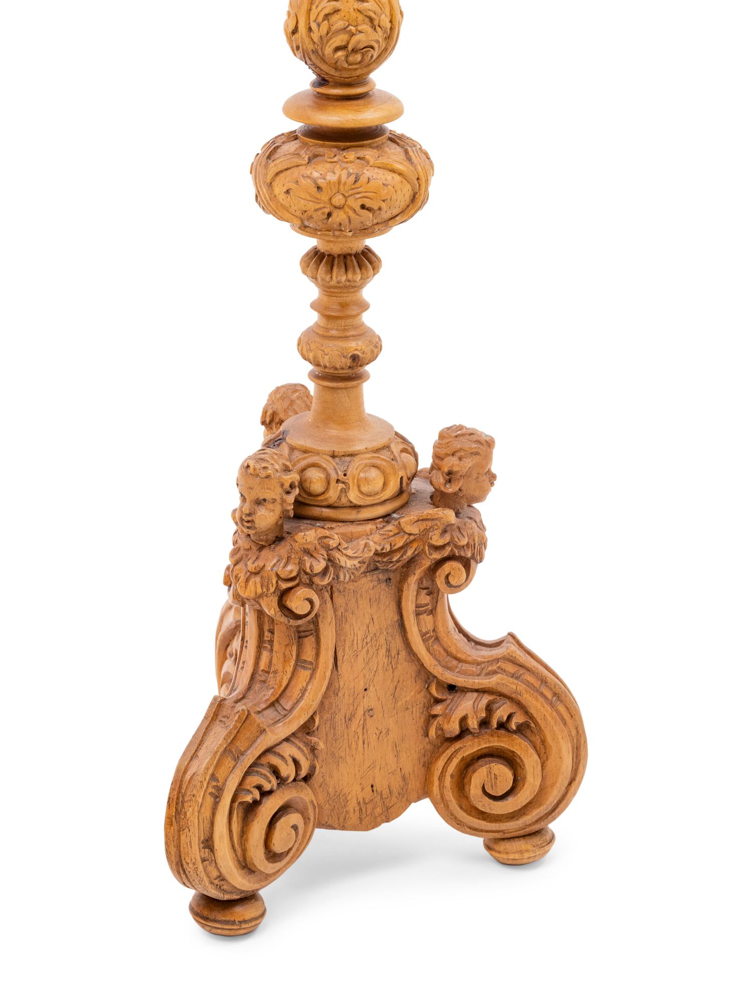 A Pair of Continental Carved Wood Prickets