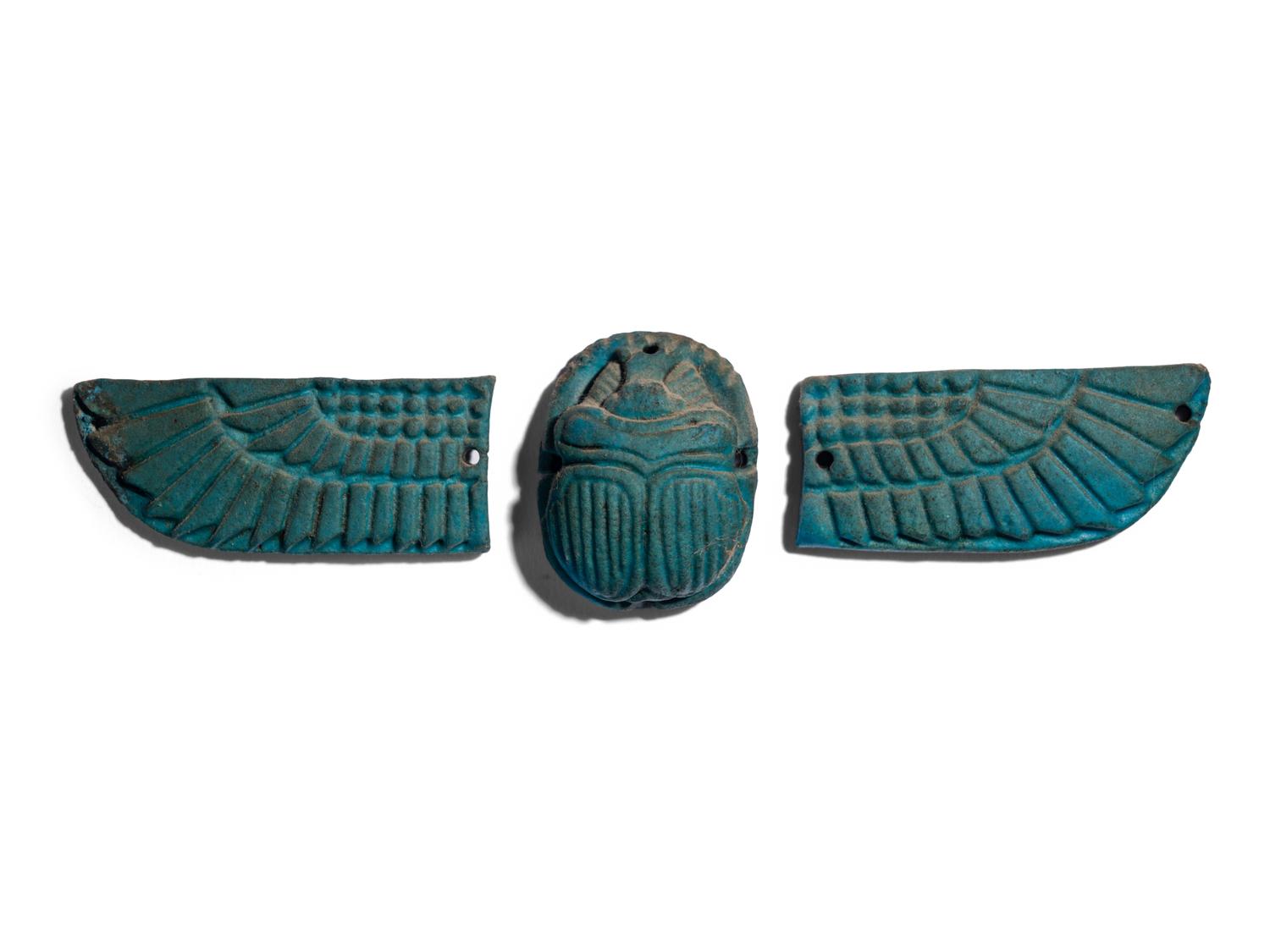 An Egyptian Faience Winged Scarab