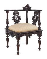 A Renaissance Revival Carved Walnut Corner Chair