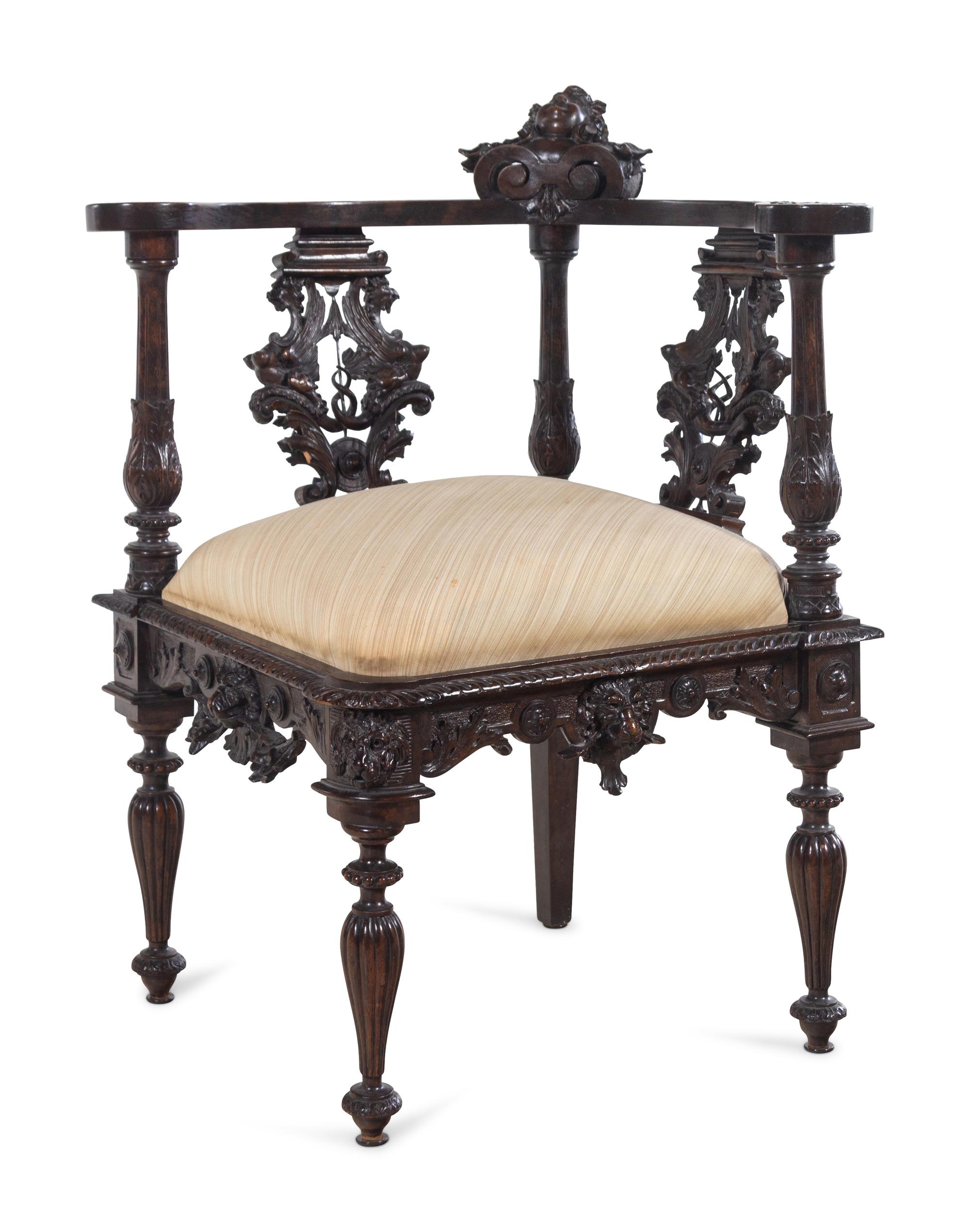 A Renaissance Revival Carved Walnut Corner Chair