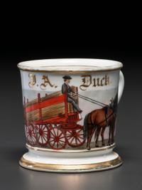 A Porcelain Occupational Shaving Mug Depicting a Lumber Wagon
