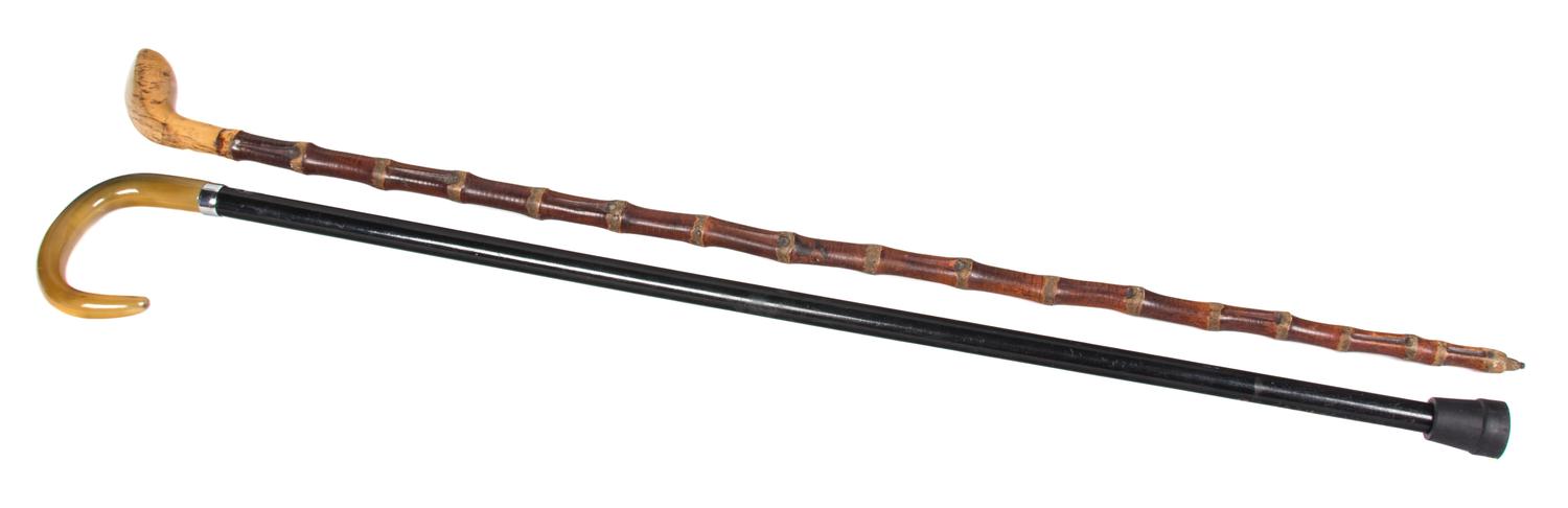 Two Walking Sticks Length of longer 36 inches.