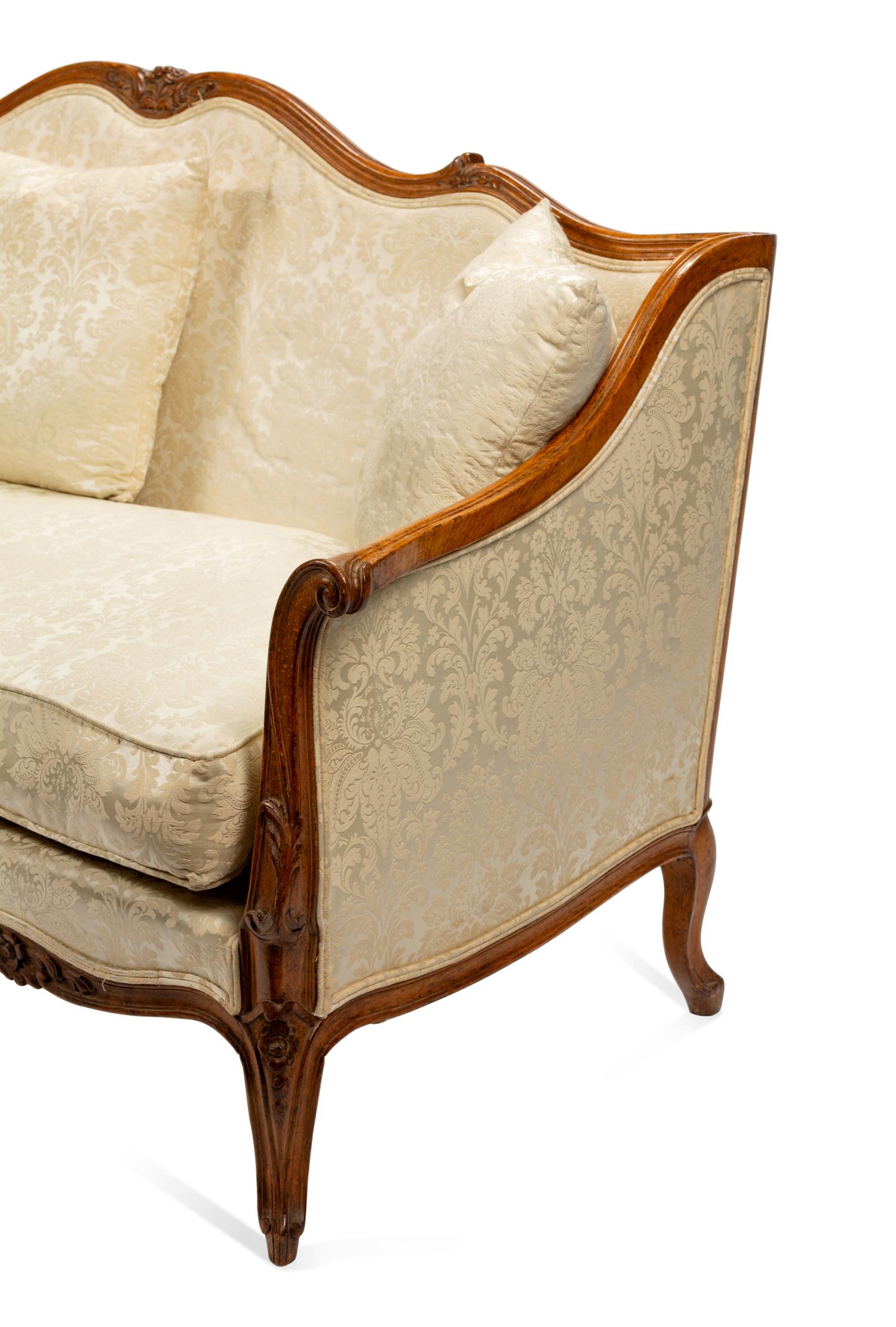 An Italian Carved Walnut Sofa in the Louis XV Taste