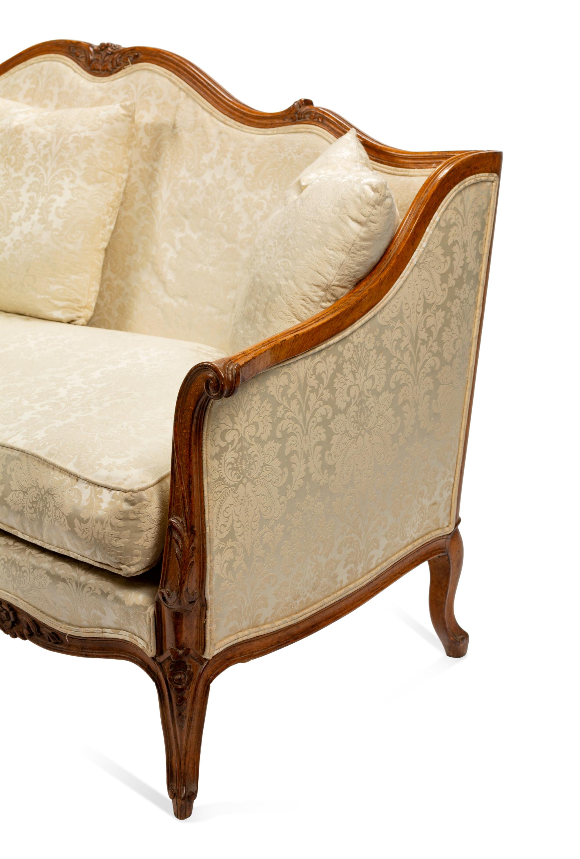 An Italian Carved Walnut Sofa in the Louis XV Taste