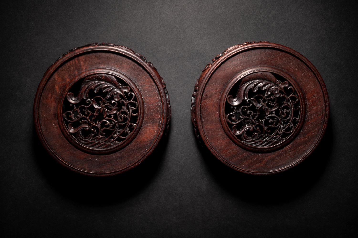 A Pair of Chinese Carved Hardwood Circular Stands