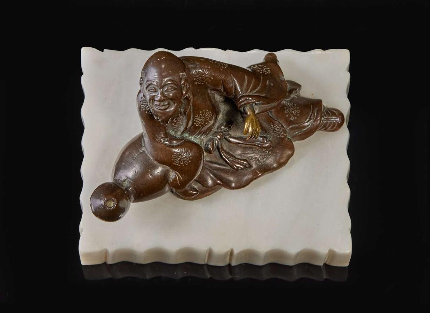A patinated bronze figural brush rest 太白醉酒銅筆架