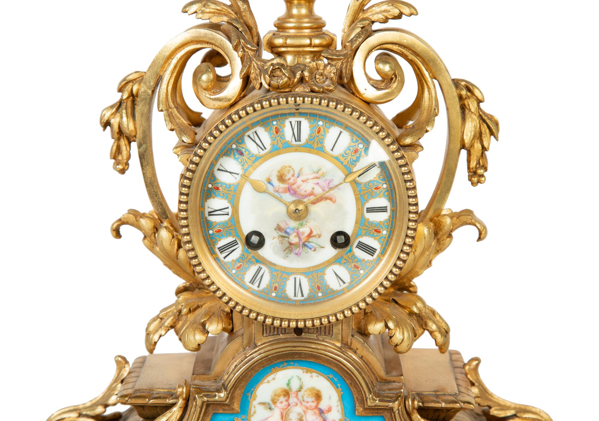 A French Gilt Bronze and Sèvres Porcelain Clock Garniture