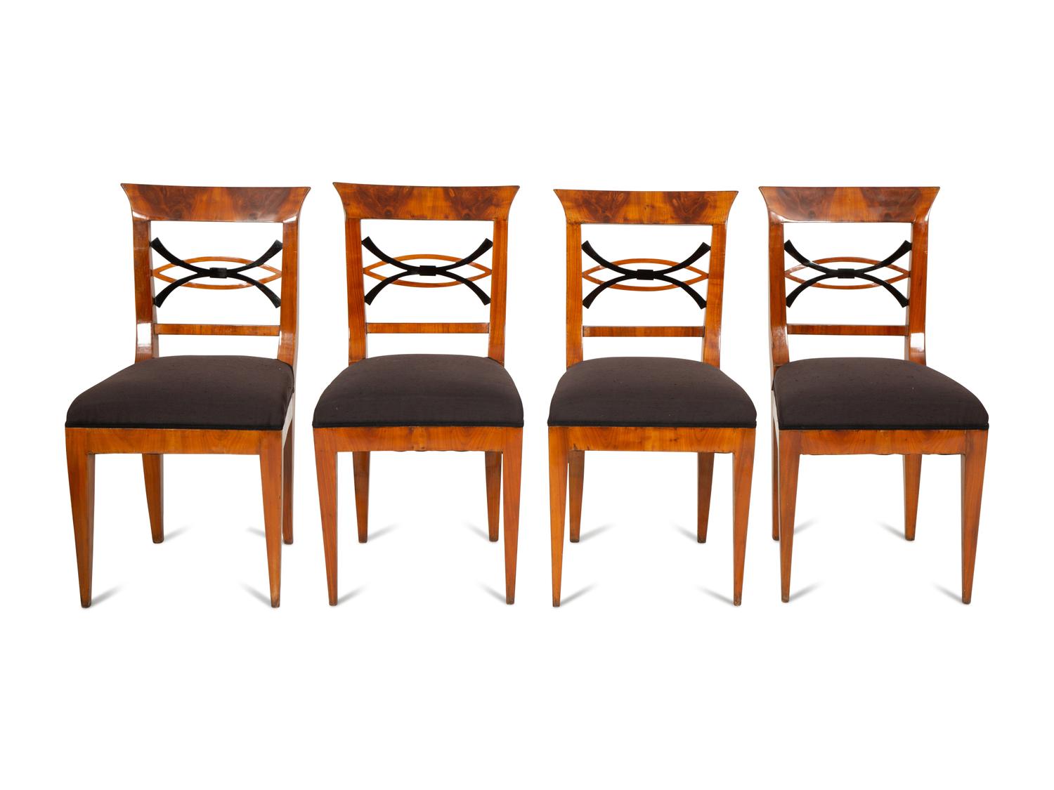 A Set of Four Biedermeier Part Ebonized Fruitwood Dining Chairs