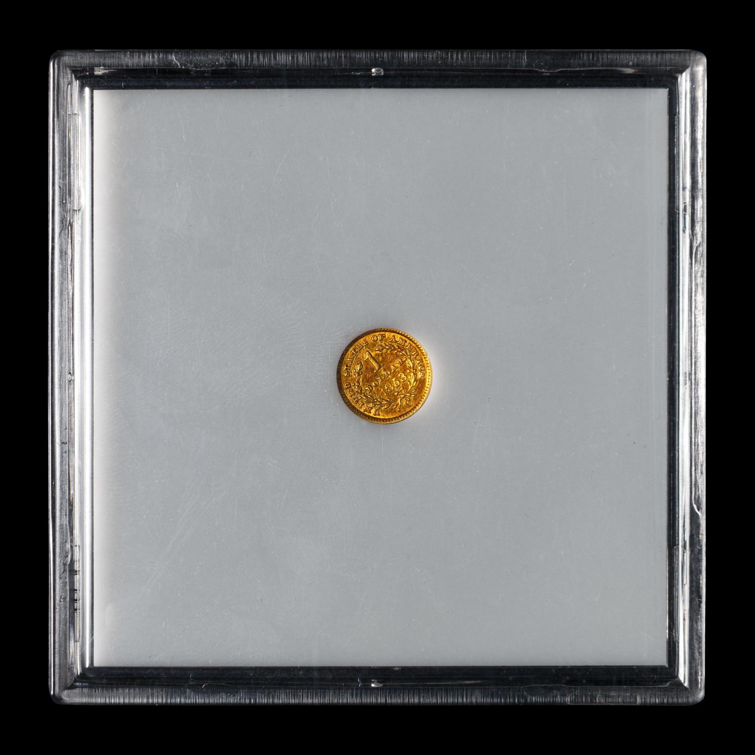 An 1853-C Liberty Head $1 Gold Coin