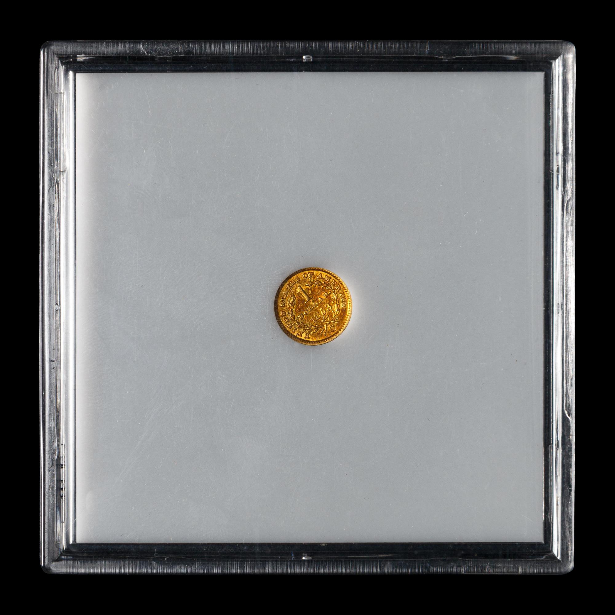 An 1853-C Liberty Head $1 Gold Coin