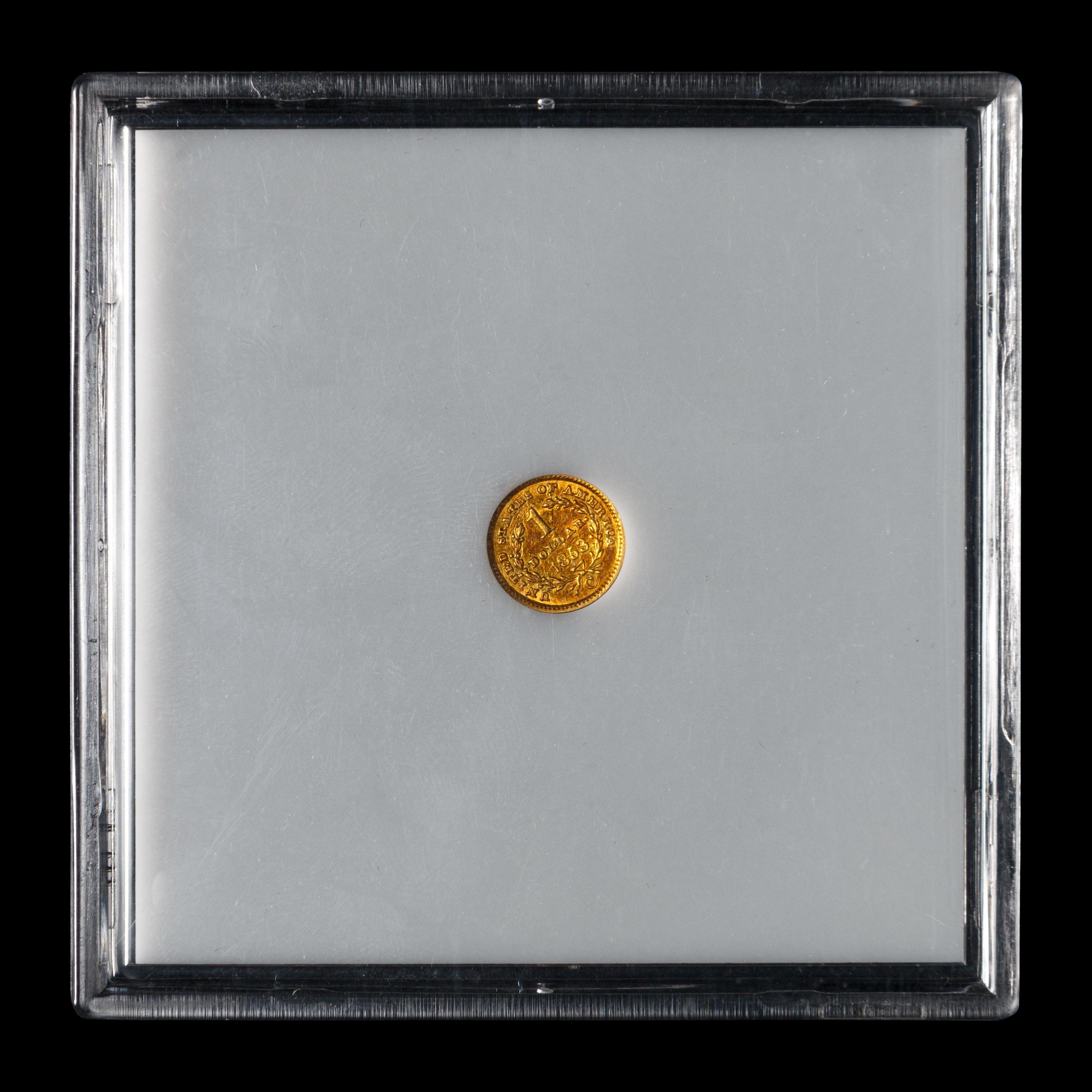 An 1853-C Liberty Head $1 Gold Coin