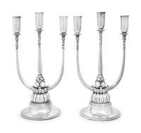 A Pair of Harald Nielsen for Georg Jensen Silver Three-Light Candelabra
