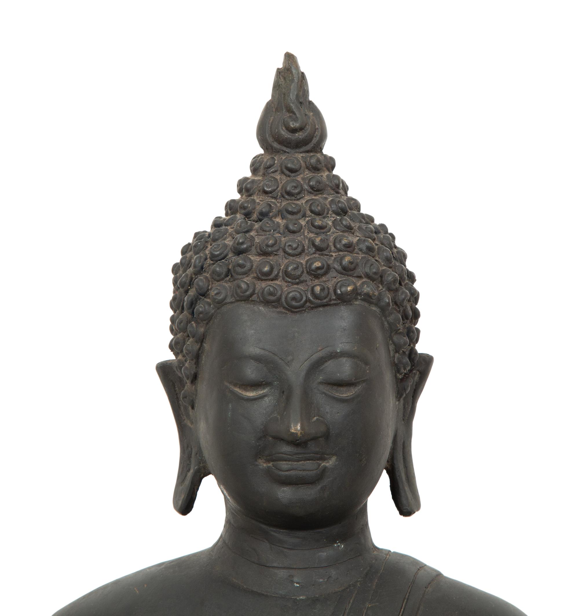 A Cambodian Bronze Figure of Seated Deity on Conforming Base