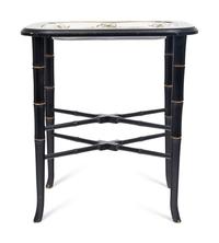 A German Porcelain Tray Set in a Later Ebonized Side Table