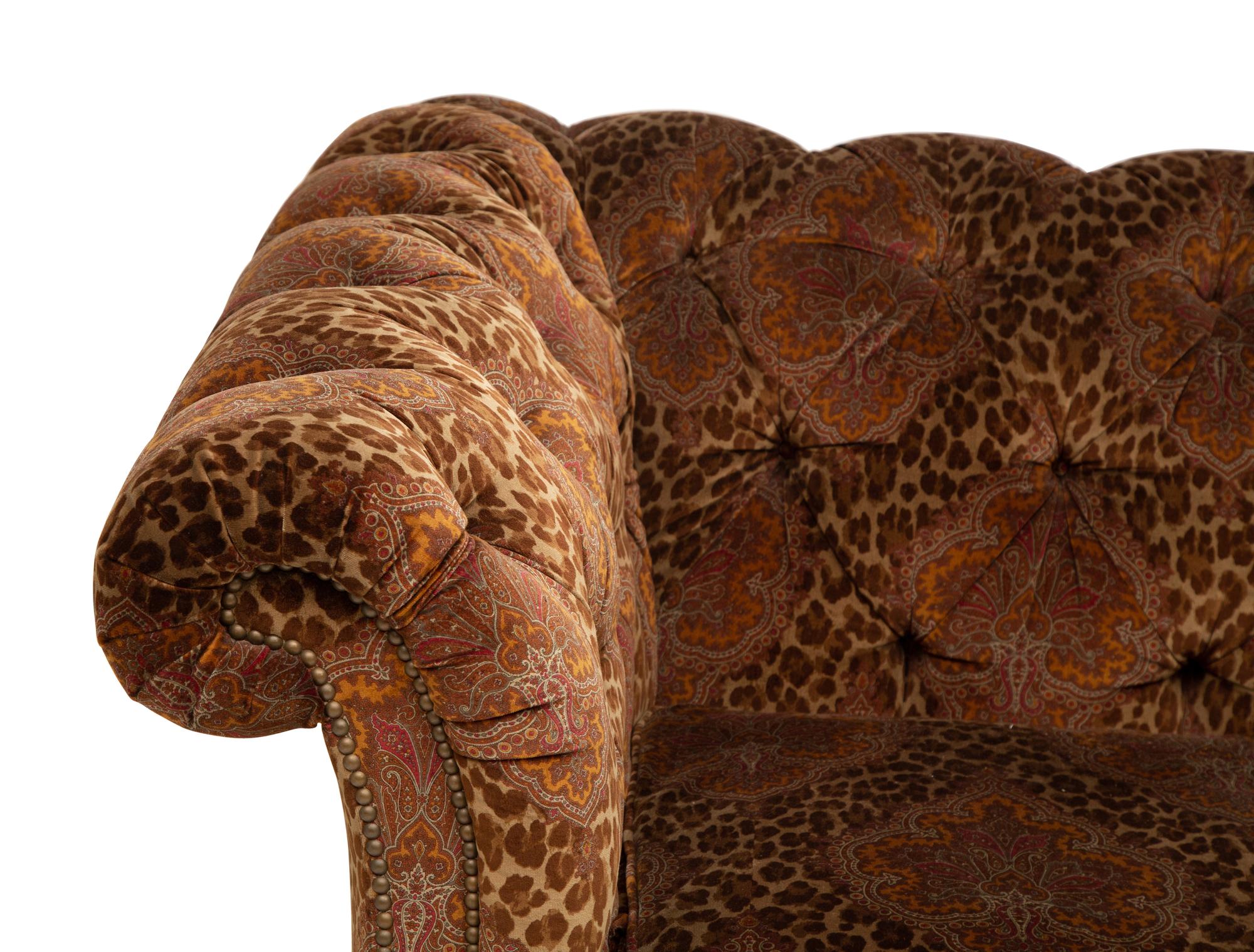 A Chesterfield Style Velvet-Upholstered Sofa with a Fringed Skirt